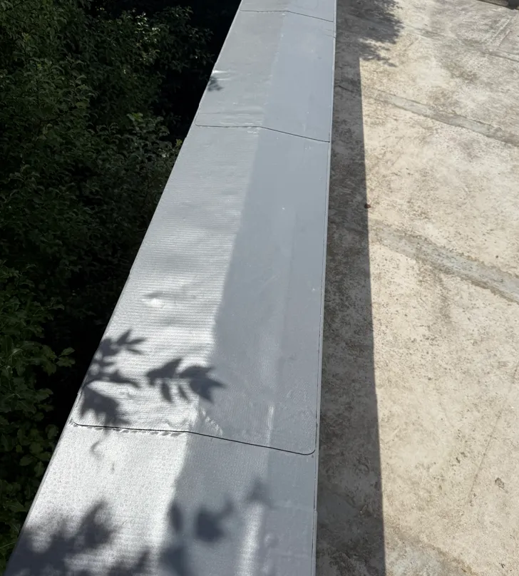 Membrane-Wrapped Parapet Cap - flat roofing project by Amber Roofs in Jersey