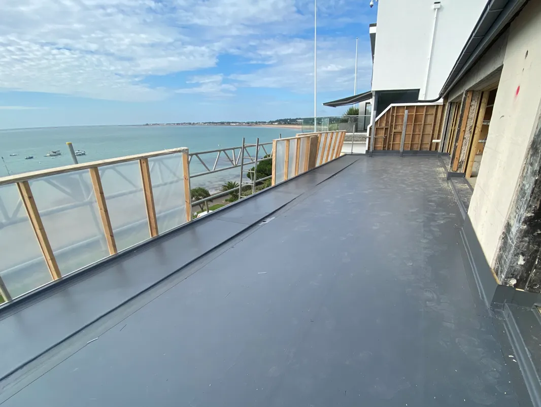 Seaside Rear Extension - flat roofing project by Amber Roofs in Jersey